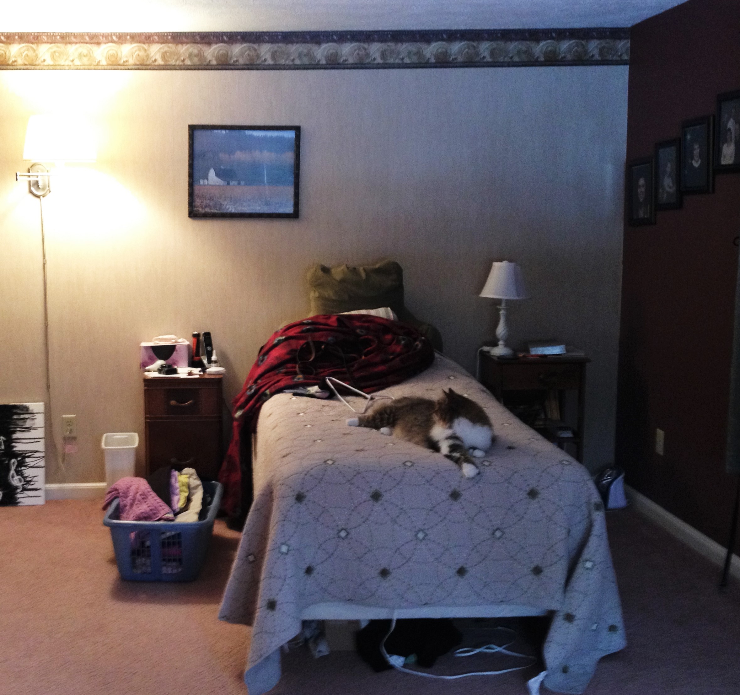 photo of bed and outdated paint and wallpaper