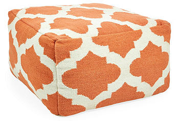 photo of orange geometric ottoman