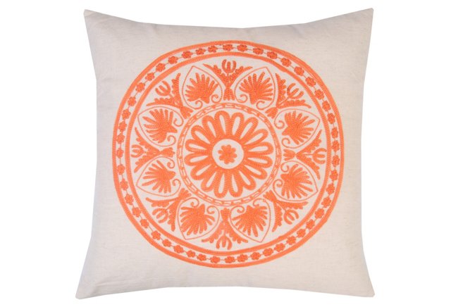photo of orange embroidered pillow
